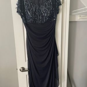 Full length Navy Blue evening gown with beading. Assymetrical bottom.